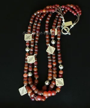 Vintage Burgundy Glass 3-Strand Necklace with Carnelian Rounds, Czech Luster Glass, Picasso Red Fire Polished Glass, Pyrite Nuggets, Hill Tribe Silver Beads & Charms, and a Sterling Silver Toggle Clasp