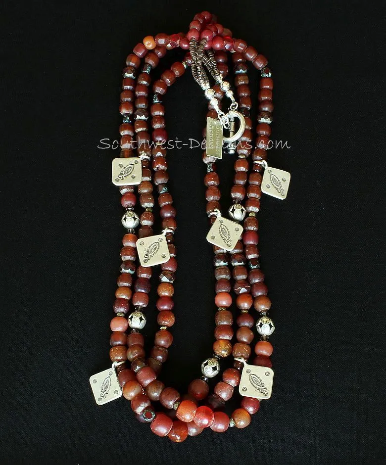 Vintage Burgundy Glass 3-Strand Necklace with Carnelian Rounds, Czech Luster Glass, Picasso Red Fire Polished Glass, Pyrite Nuggets, Hill Tribe Silver Beads & Charms, and a Sterling Silver Toggle Clasp